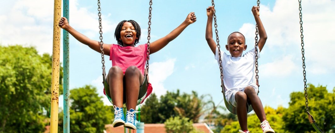 boy and girl on swing